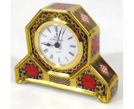 A Royal Crown Derby Old Imari quartz mantel clock, with 5cm dia. Roman numeric dial, printed marks beneath, 11cm high.