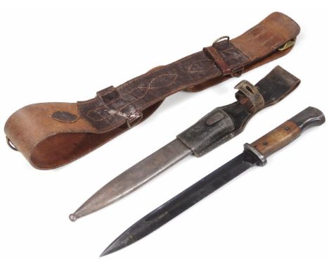 A early 20thC bayonet style dagger, with metal scabbard and leather mount, with wooden handle and part metal pommel, 43cm wid