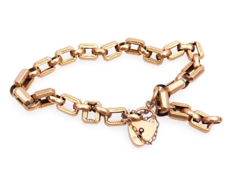 A shaped bracelet, partially engine turned with heart shaped clasp, one link set with a hoop marked 9ct, 14.8g, 18cm long.
