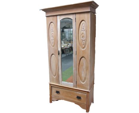 An Edwardian style light wood single door wardrobe, the central glass flanked by oval columns surmounted by a (removable) cor