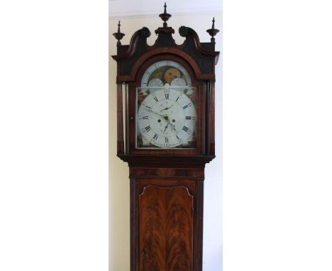 An early 19thC mahogany moon rolling longcase clock, the fancy swan neck pedimented hood surmounted by three urn finials, rai