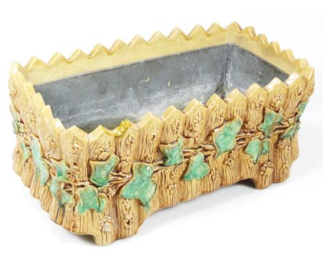A 19thC English Majolica pottery planter, with a ivy leaf and textured panel banding, of shaped rectangular outline, with inn