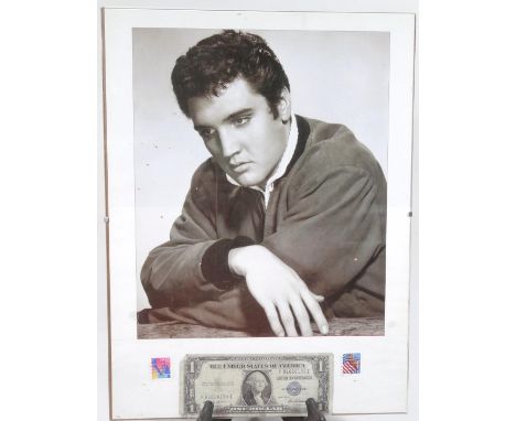 An Elvis Presley print, he seated in melancholic mood, framed with stamp and dollar bill, with a in Perspex style front, 40cm