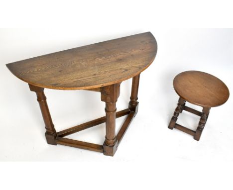 A 17th century style carved oak credence type table, height 71cm, width 97cm, depth 43cm, with a circular occasional table (2