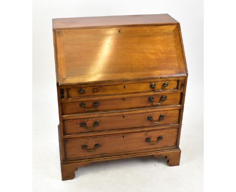 An Edwardian mahogany bureau, with fall front enclosing a fitted interior above four graduated long drawers, on bracket feet,