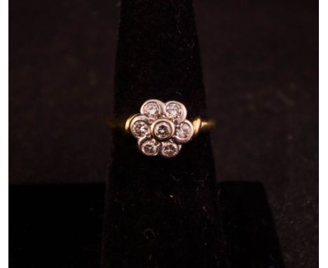 18CT DAISY RING WITH DIAMOND SET. TOTAL .5CT YELLOW GOLD BAND WITH WHITE GOLD SETTING. SIZE N