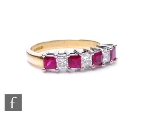 An 18ct hallmarked ruby and diamond half eternity ring comprising seven alternating square cut rubies and diamonds, all claw 