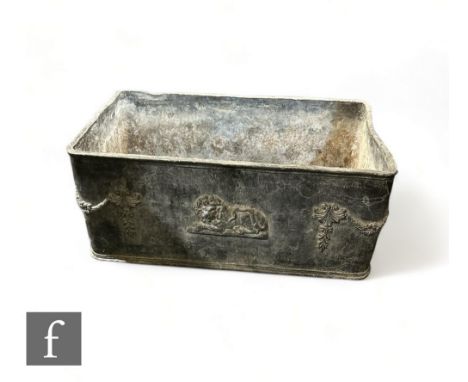 A 19th Century or later rectangular lead planter, the side applied with swags and recumbent lions, height 26cm x depth 35cm x