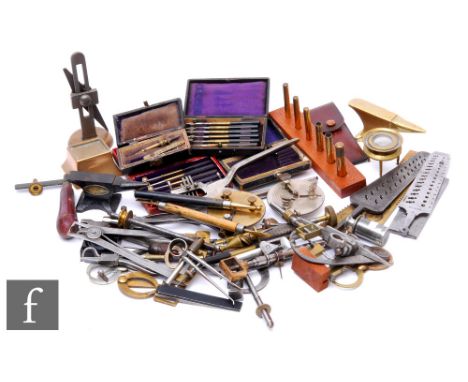 A large assortment of 19th and early 20th Century watch maker's tools, to include callipers, measuring instruments and gauges