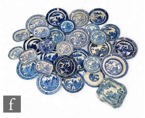 A large collection of blue and white transfer printed wares, to include dishes, plates, bowls and teapot stands, factories in