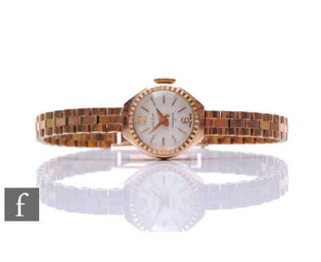 A lady's 9ct hallmarked manual wind Victor wrist watch to an integral 9ct brick bracelet, total weight 13.5g, London 1969. 