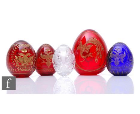 A 20th Century Faberge glass egg, engraved and gilt on both sides with a Russian Eagle with panels of diamonds all over a rub