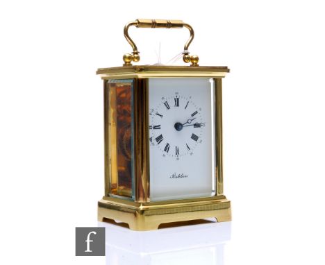 A 20th Century French brass carriage clock, named 'Postilion', with key, height 12cm. 