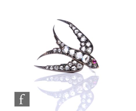 A 19th Century silver gilt diamond set brooch modelled as a swallow with a single set ruby eye, weight 5g, length 3cm. 