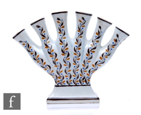 An early 19th Century Prattware quintal flower vase, the rectangular base rising to a six trumpet form body, all hand enamell