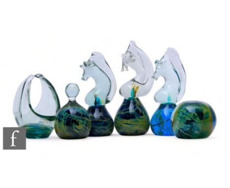 A collection of Mdina glass paperweights, comprising three of seahorse form, one of dome form, another of globe form with upp