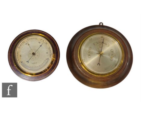 An Edwardian and chequer strung inlaid circular aneroid barometer by C.S.S.A Ltd London, silvered dial, and a similar post 19