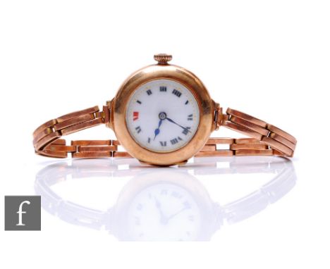 A 9ct hallmarked rose gold manual wind wrist watch, Roman numerals to a white enamelled dial, to a 9ct rose gold expanding br
