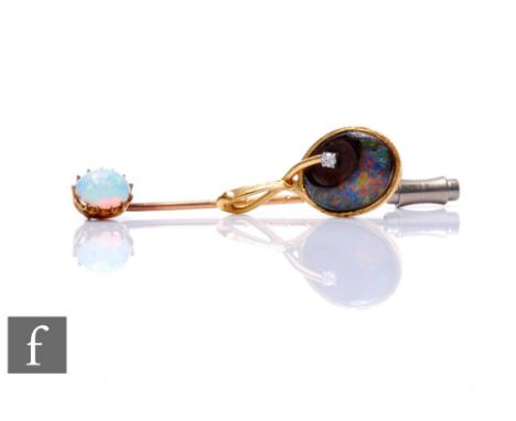 An 18ct black opal pendant set with a single diamond, with a 9ct opal stick pin. (2) 