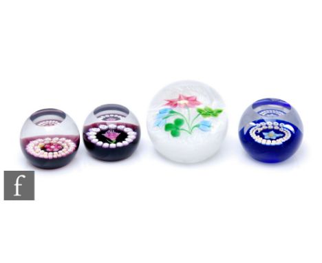 A later 20th Century Caithness glass paperweight, designed by Allan Scott in the Irish Bouquet pattern, of domed form and int