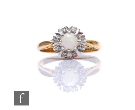 An 18ct hallmarked opal and diamond cluster ring, central opal to an eight stone diamond surround, weight 3.5g, ring size O. 