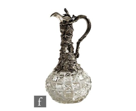 A late 19th Century silver plated and clear cut glass claret jug with hob nail cut globe and shaft decanter with plated fruit