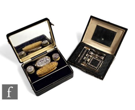 An early 20th Century satin, marcasite mounted evening bag opening to fitted interior with opera glasses, compact, lipstick, 