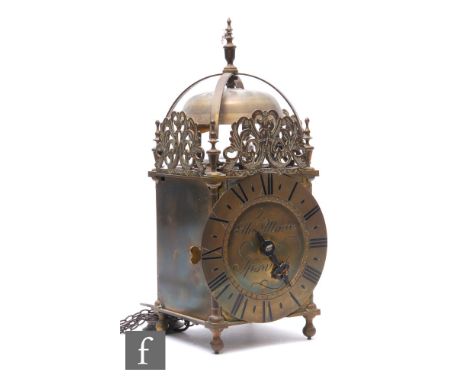 A 17th Century style brass lantern clock, the circular dial inscribed Thomas Moore Ipswich, the movement striking on a bell, 