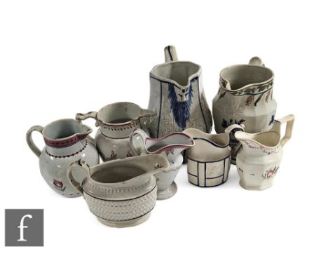 An early 19th Century Prattware jug of footed baluster form, relief moulded with stiff leaf and floral borders picked out in 