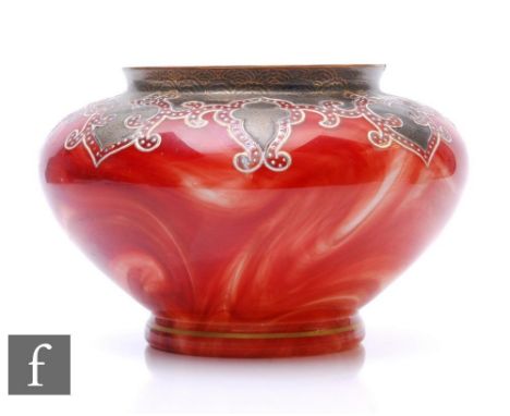 A late 19th Century Loetz bowl of squat form with narrow base and short collar neck, decorated in the Marmoriete pattern with