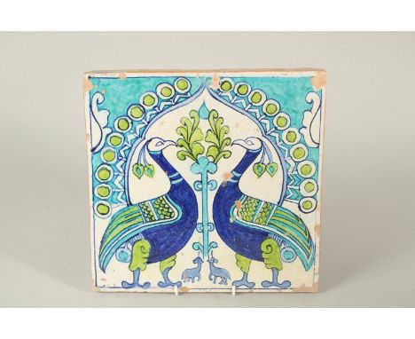 AN UNUSUAL 19TH CENTURY NORTH INDIAN MULTAN GLAZED POTTERY TILE, depicting two peacocks, 30cm x 30.5cm.