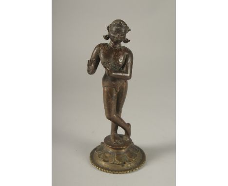 A RARE LARGE 16TH CENTURY OR EARLIER INDIAN BRONZE FIGURE OF FLUTING KRISHNA, (the base possibly 18th century), 24cm high.