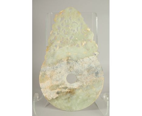 A LARGE CHINESE JADE DISK, with incised characters, 33.5cm x 21cm.