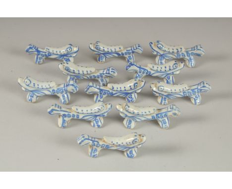 A COLLECTION OF CHINESE BLUE AND WHITE PORCELAIN BRUSH RESTS / CHOPSTICK RESTS, (qty).