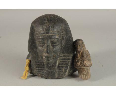 A RARE LARGE POSSIBLY ANCIENT EGYPTIAN CARVED BLACK STONE BUST, 15cm high, along with two other pottery figures, (3).