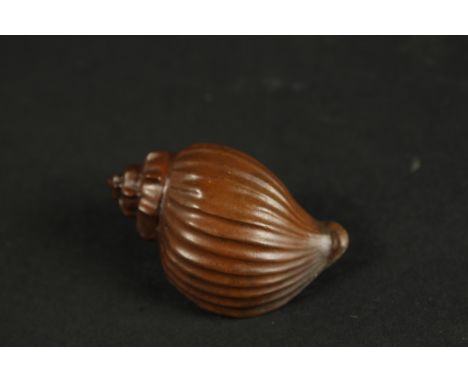 A BRONZE OKIMONO OF A SEA SNAIL.