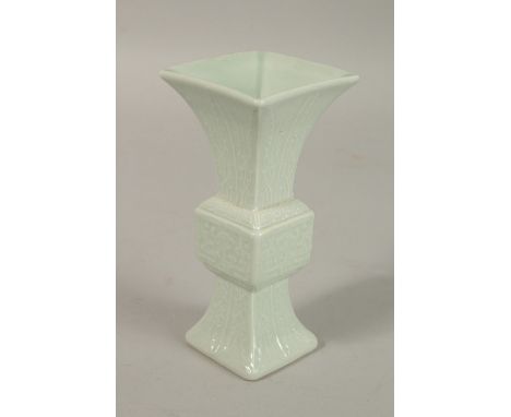 A CHINESE CELADON MINIATURE PORCELAIN GU VASE, with six-character mark, 12.2cm high.