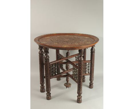 A FINE 19TH CENTURY SYRIAN DAMASCUS MOTHER OF PEARL INLAID WOODEN TABLE, with folding legs.