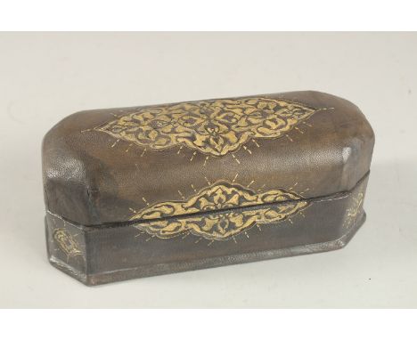 A TURKISH LEATHER OVERLAID WOODEN PEN BOX, 22.5cm long.