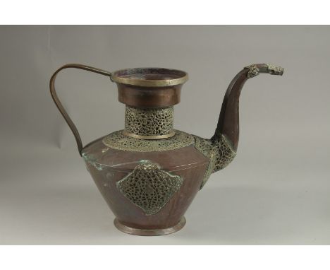 A LARGE 19TH CENTURY TIBETAN WHITE METAL MOUNTED COPPER EWER, 29cm high.