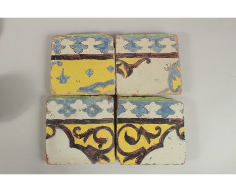 A COLLECTION OF FOUR 18TH CENTURY PERSIAN CUERA SECA POTTERY TILES, (4).