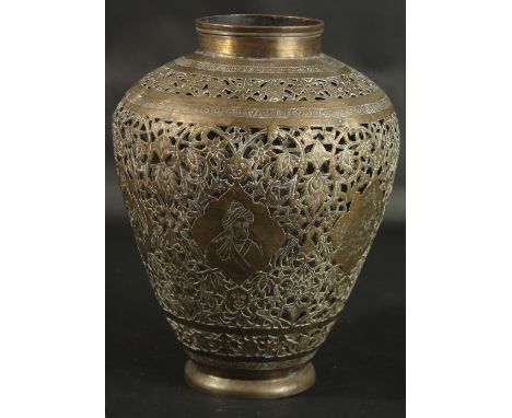 A LARGE ISLAMIC PERSIAN OPENWORKED BRASS VASE, engraved with portraits and animals, 30cm high.