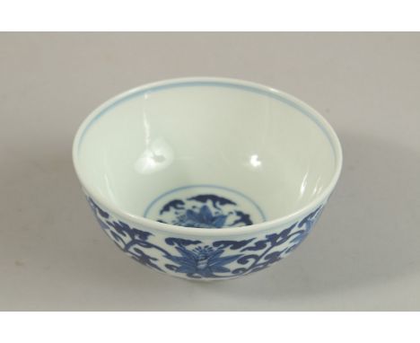 A CHINESE BLUE AND WHITE PORCELAIN BOWL, with six-character mark, 12cm diameter.