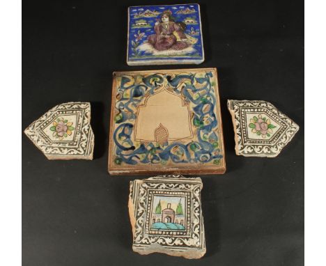 A PERSIAN QAJAR GLAZED POTTERY TILE AND CORNER TILE (in three pieces), together with another glazed pottery tile with mosque 