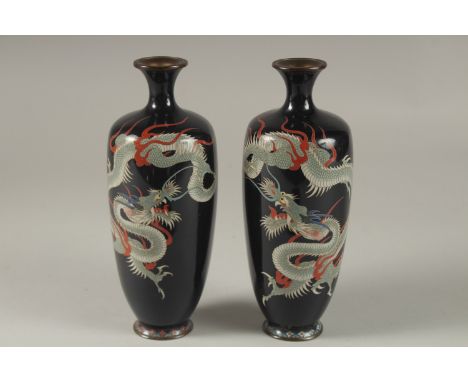 A FINE PAIR OF JAPANESE MIDNIGHT BLUE GROUND CLOISONNNE ENAMELLED VASES, decorated with dragons, signed to base, 18.5cm high.