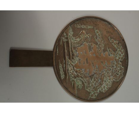 A CHINESE MIRROR, with large central character.