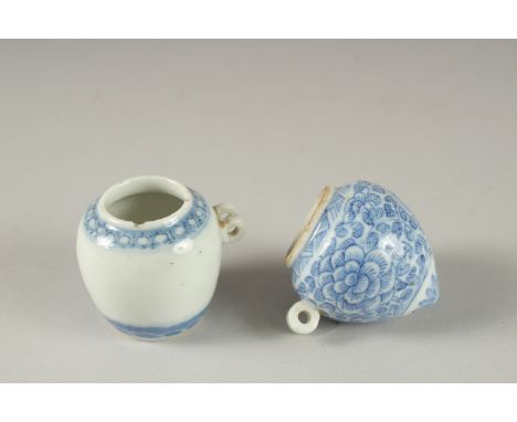 TWO CHINESE BLUE AND WHITE PORCELAIN BIRD FEEDERS.