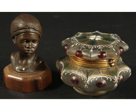 AN AFRICAN BRONZE BUST TOGETHER WITH A DECORATIVE GLASS BOX, (2).