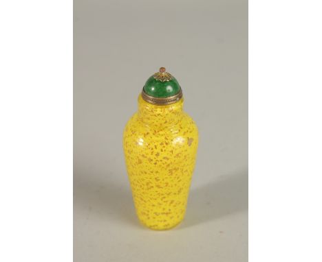 A FINE CHINESE PEKING GLASS BOTTLE, with specks of gold and green stone stopper - possibly jade, 8.5cm high.