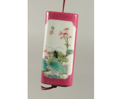 AN UNUSUAL CHINESE FAMILLE ROSE PORCELAIN INRO, the inner case painted with erotic scenes, (small repair to outer case), 9cm 